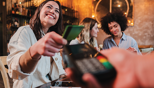 Friends eating out with credit card